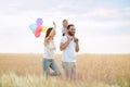 Happy family of mom, dad and son walking outdoors Royalty Free Stock Photo