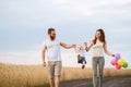 Happy family of mom, dad and son walking outdoors Royalty Free Stock Photo