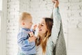 Happy Family Mom and her Cute Son Hugging at Home. Royalty Free Stock Photo