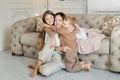 Happy family. Mom hugs son and daughter, love. Cheerful joyful emotions on the face of a woman, a boy and a girl. Family leisure Royalty Free Stock Photo