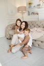 Happy family. Mom hugs son and daughter, love. Cheerful joyful emotions on the face of a woman, a boy and a girl. Family leisure Royalty Free Stock Photo