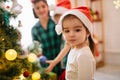 Happy family mom, son and daughter on a Christmas winter sunny morning in a decorated Christmas celebration room with a Royalty Free Stock Photo