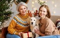 Happy family mother and adult grown up daughter celebrating New Year or Christmas together Royalty Free Stock Photo