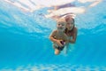 Mother with baby swimming, diving underwater with fun in pool Royalty Free Stock Photo