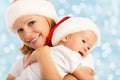 Happy family mother and baby in Christmas hats Royalty Free Stock Photo