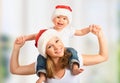 Happy family mother and baby in Christmas hats Royalty Free Stock Photo