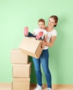 Happy family mother and baby daughter in an empty apartment with Royalty Free Stock Photo