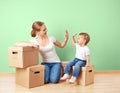 Happy family mother and baby daughter in an empty apartment with Royalty Free Stock Photo