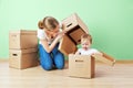 Happy family mother and baby daughter in an empty apartment with Royalty Free Stock Photo