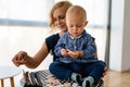 Happy family. Mother and baby daughter plays, hugging, kissing at home Royalty Free Stock Photo