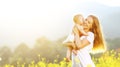 happy family mother and baby hugging and kiss in summer on nature Royalty Free Stock Photo