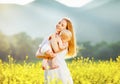 Happy family mother and baby hugging nature in summer Royalty Free Stock Photo