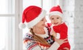 Happy family mother and baby playing at home for Christmas Royalty Free Stock Photo