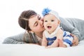 Happy family. Mother and baby playing and smiling under a blanket