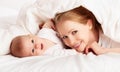 Happy family. Mother and baby playing under blanket Royalty Free Stock Photo