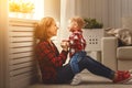 Happy family mother and baby son hugging, playing and laughing Royalty Free Stock Photo