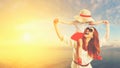 Happy family mother and child daughter on beach at sunset Royalty Free Stock Photo