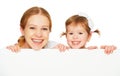 Happy family mother child daughter with blank white poster Royalty Free Stock Photo