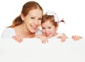 Happy family mother child daughter with blank white poster Royalty Free Stock Photo