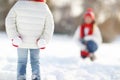 happy family mother and child daughter having fun, playing snowballs at winter walk Royalty Free Stock Photo