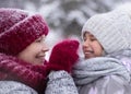 Happy family mother and child daughter having fun, playing at winter walk outdoors Royalty Free Stock Photo