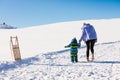 Happy family mother and child daughter having fun, playing at winter walk outdoors Royalty Free Stock Photo