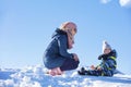 Happy family mother and child daughter having fun, playing at winter walk outdoors Royalty Free Stock Photo