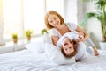 Happy family mother and child daughter laugh in bed Royalty Free Stock Photo