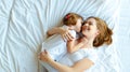 Happy family mother and child daughter laugh in bed Royalty Free Stock Photo