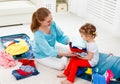 happy family mother and child daughter suitcases packed for vacation