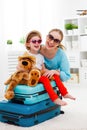 happy family mother and child daughter suitcases packed for vacation