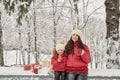 Happy family mother and child daughter on winter walk outdoors drinking tea. happy family mother and baby little child playing in Royalty Free Stock Photo