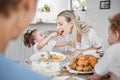 Happy family, mother and child eating chicken and vegetables in a healthy meal for dinner in Germany, Berlin. Food Royalty Free Stock Photo
