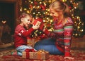 Happy family mother and child girl with Christmas present Royalty Free Stock Photo