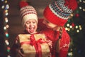 Happy family mother and child girl with Christmas present Royalty Free Stock Photo