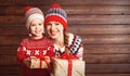 Happy family mother and child girl with Christmas present Royalty Free Stock Photo