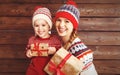 Happy family mother and child girl with Christmas present Royalty Free Stock Photo