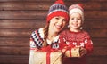 Happy family mother and child girl with Christmas present Royalty Free Stock Photo