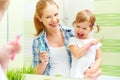 Happy family mother and child girl cleans teeth with toothbrush Royalty Free Stock Photo