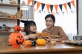 Happy family mother and child happy girl with holiday Halloween. Happy Halloween. Recipe pumpkin puree. Ingredients for Royalty Free Stock Photo