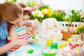 Happy family mother and child girl paints eggs for Easter Royalty Free Stock Photo