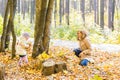 Happy family mother and child girl playing throw leaves in autumn park outdoors Royalty Free Stock Photo