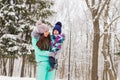 Happy family. Mother and child girl on a winter walk in nature. Royalty Free Stock Photo