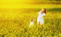 Happy family, mother and child l little daughter running on mea Royalty Free Stock Photo