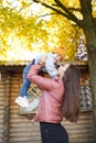 Happy family mother and child little boy playing in autumn park outdoors Royalty Free Stock Photo