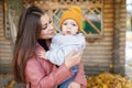 Happy family mother and child little boy walking in autumn park outdoors Royalty Free Stock Photo