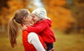 Happy family. mother and child little daughter play kissing on a Royalty Free Stock Photo