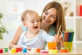 Happy family mother and child painting together Royalty Free Stock Photo