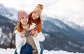 Happy family mother and child playing on winter walk Royalty Free Stock Photo