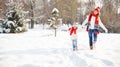 Happy family mother and child playing on winter walk Royalty Free Stock Photo